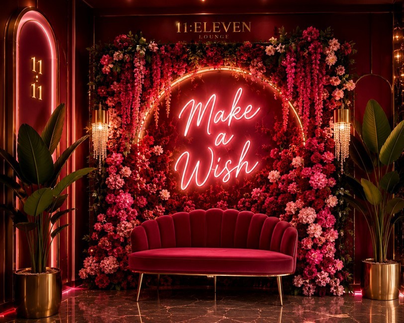 Make a Wish photo wall near the ladies' restroom with a velvet loveseat and neon script sign